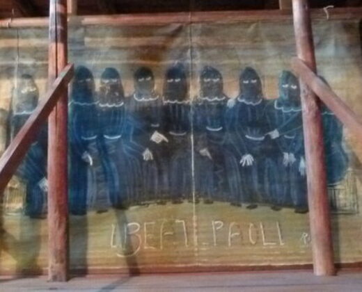 Toile peinte représentant un groupe d'hommes au visage caché par une cagoule noire