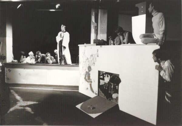 Photograph showing puppeteers rehearsing a scene.